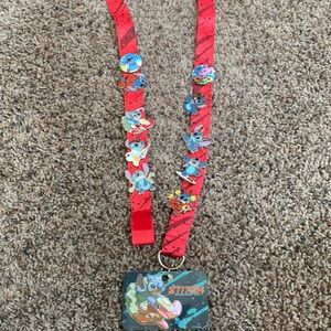 Stitch collective pins and a lanyard!